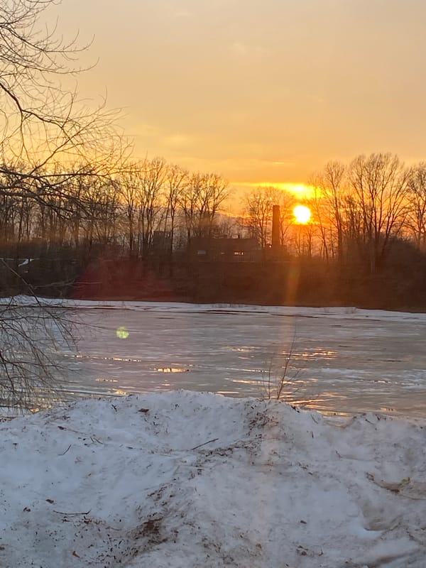 Winter sunset observed over frozen water in Chaikovsky, Russia