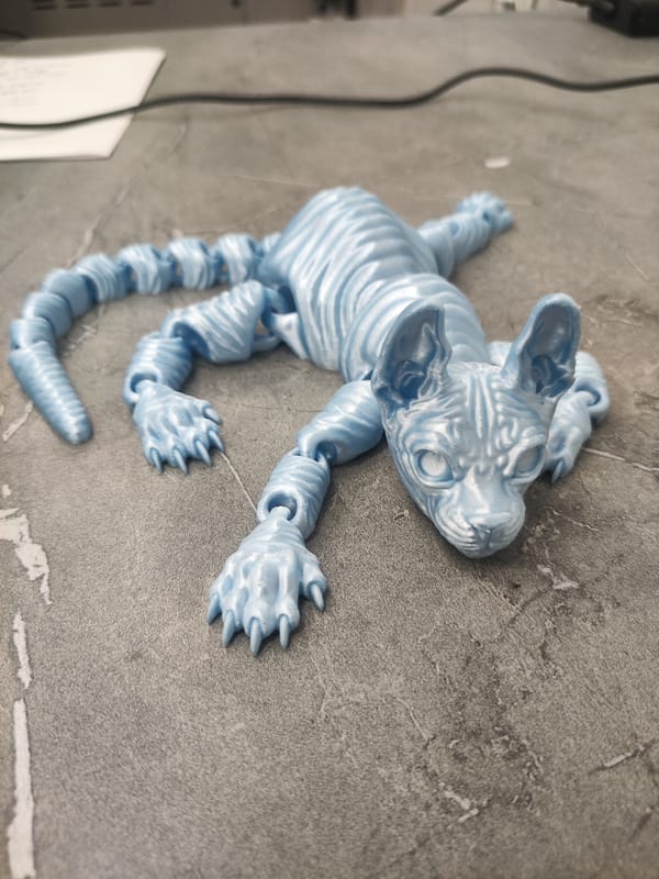 3D-printed figures fresh off the machine in a Tashkent workshop