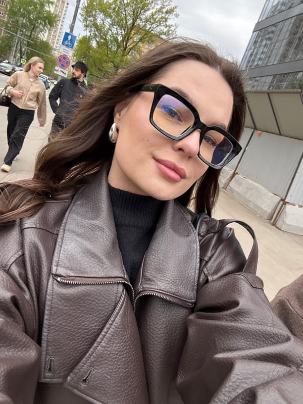 Woman takes selfie on Moscow sidewalk