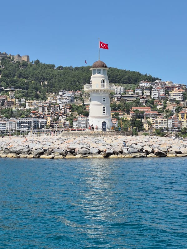 Tourist boats active in Alanya harbor during morning hours
