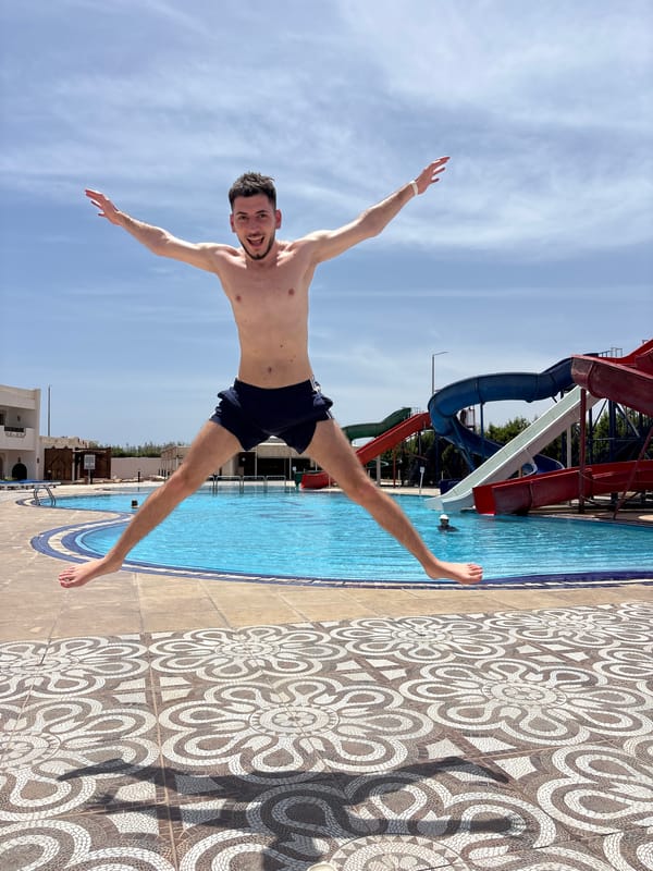 Couple enjoys pool day at water park resort