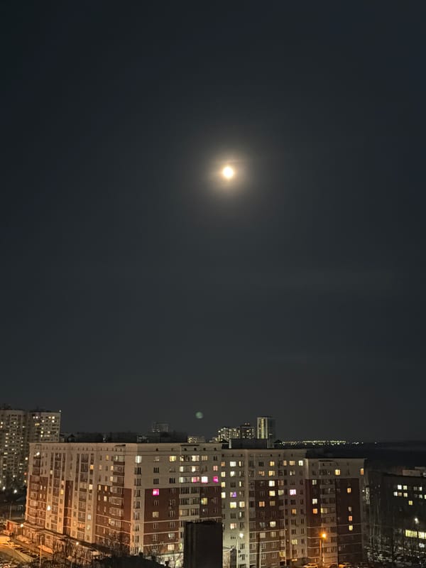 Moonlit night scene over residential apartments in Izhevsk