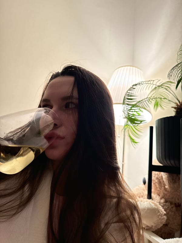 Woman enjoys wine at home in Odintsovo evening