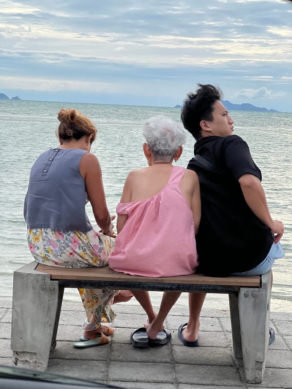 Overcast morning at Ko Samui's shore, ferry passing offshore