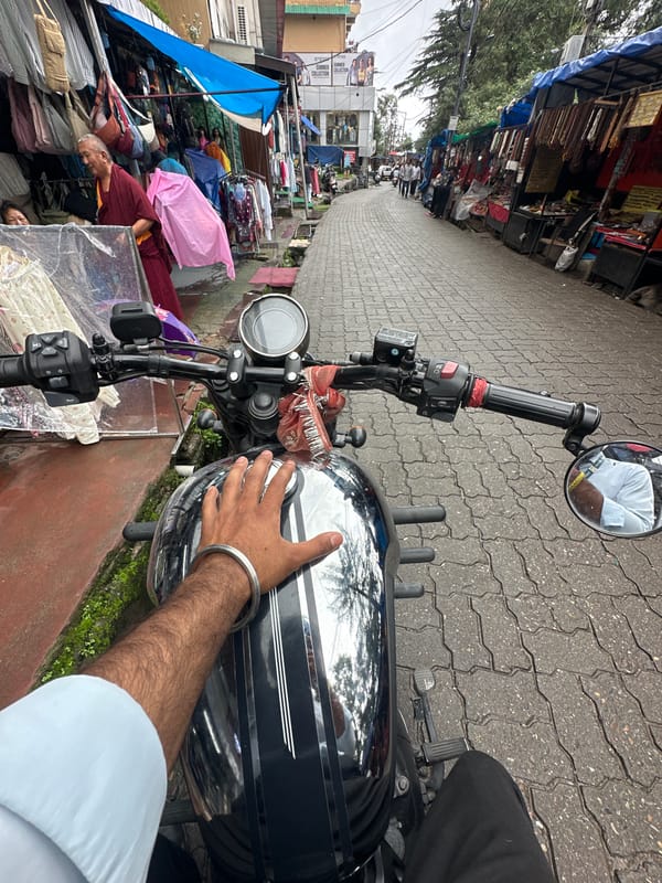 Morning motorcycle ride through a busy street market