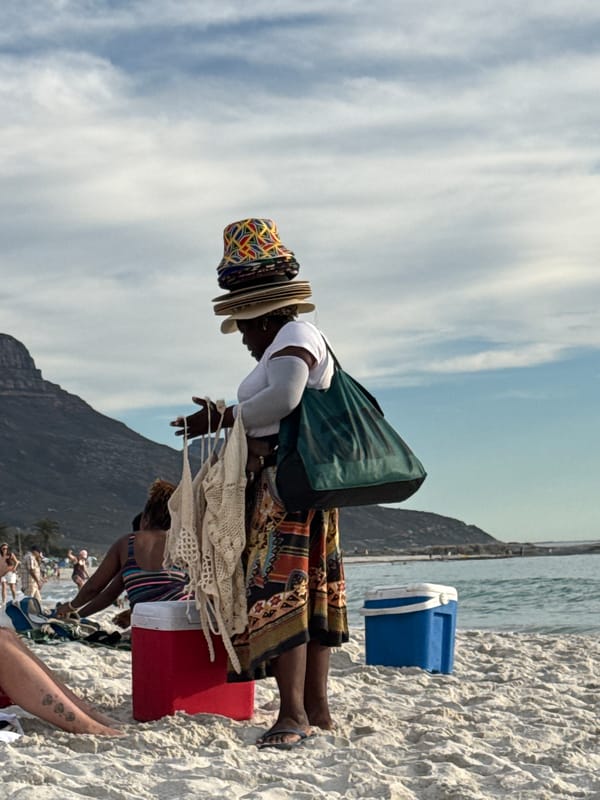 Beachgoers jog and play in Cape Town waters