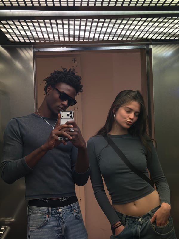 Elevator selfie in London, styled and relaxed.