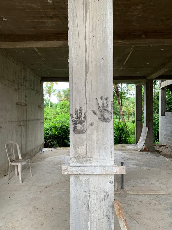Residential property documentation includes mysterious handprints on concrete pillar