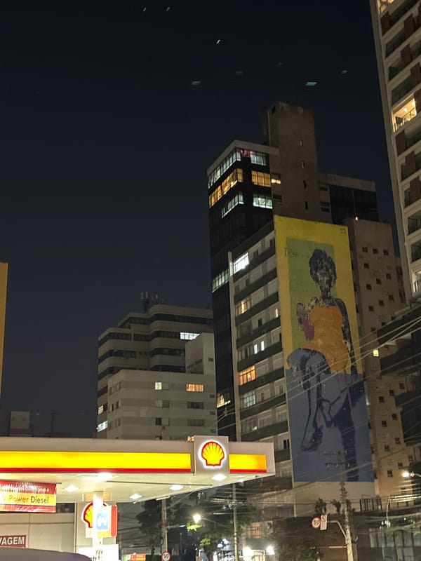 São Paulo night streets: gas stations, murals, and a bike shop