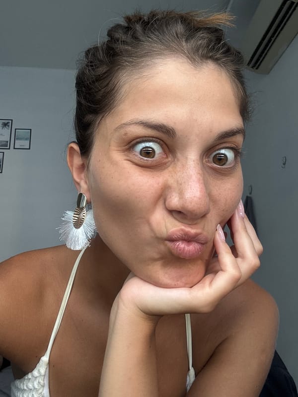 Woman in Brooklyn cap photographed indoors in Đà Nẵng