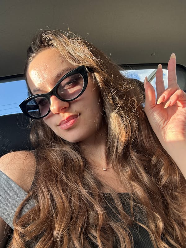 Woman makes peace sign gesture in vehicle, Israel