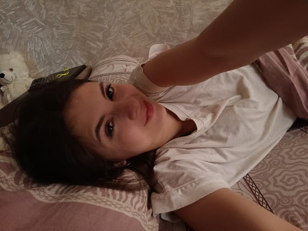 Woman rests in bedroom during morning hours in Chaikovsky