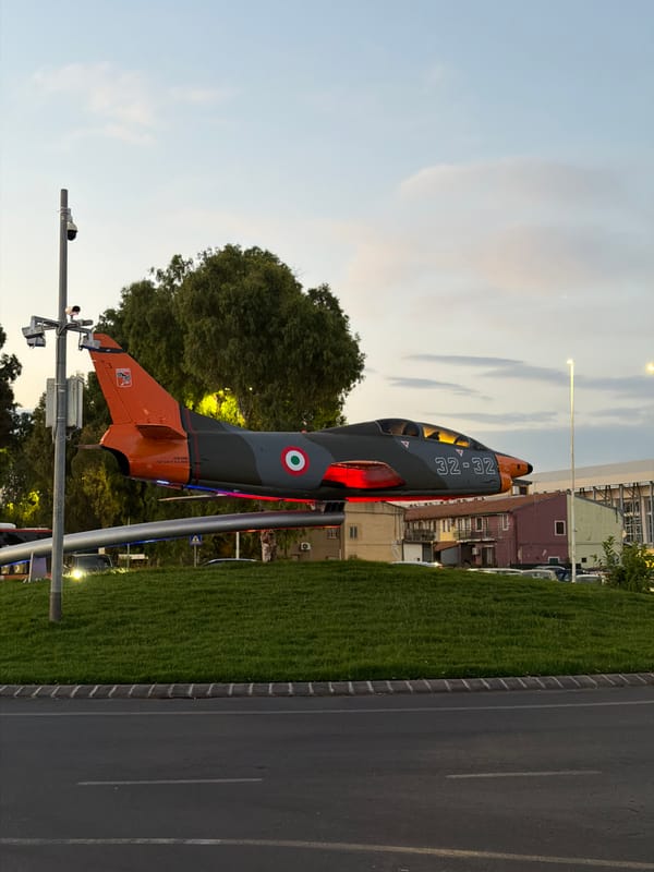 Military aircraft display and fallen road sign observed in Catania