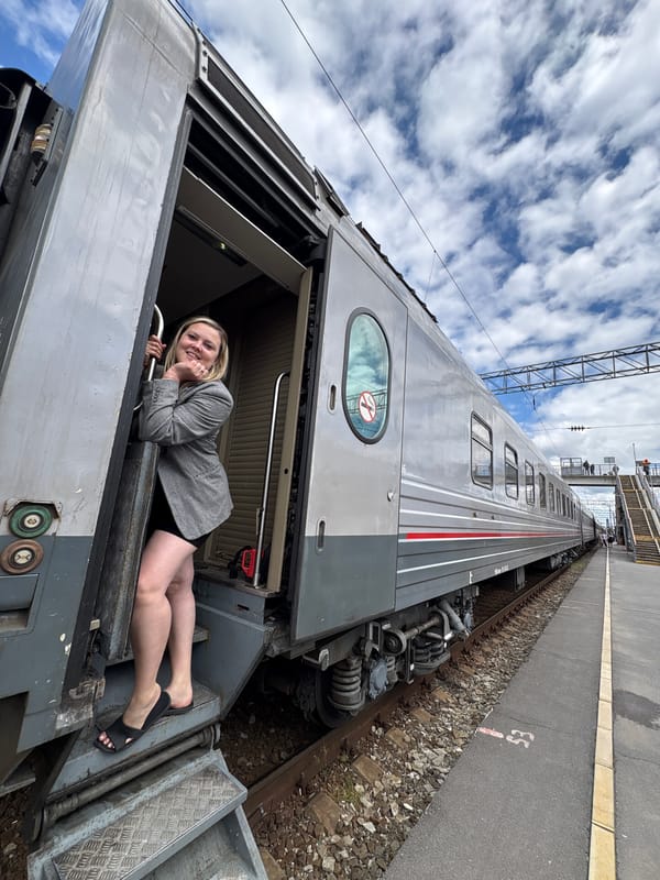 Woman photographs herself at train station in Rostov-on-Don