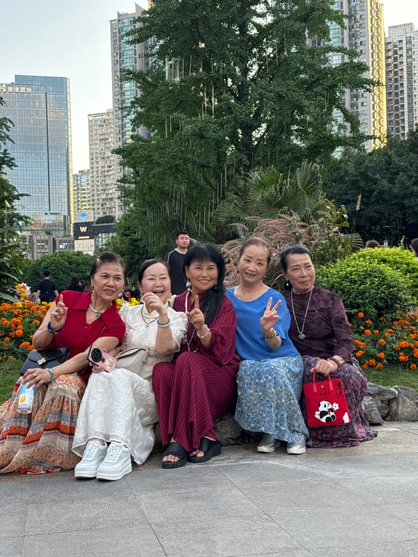 Women pose for group photos in Liangjiang park