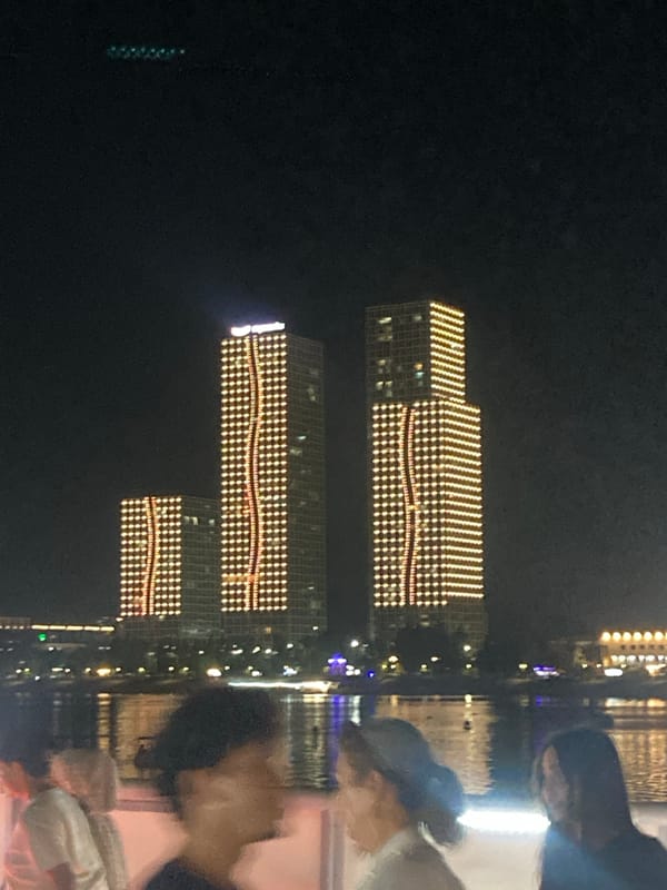 Astana's illuminated skyline and nightlife on a June evening