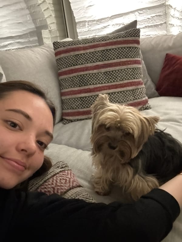 Woman spends quiet morning at home with small dog