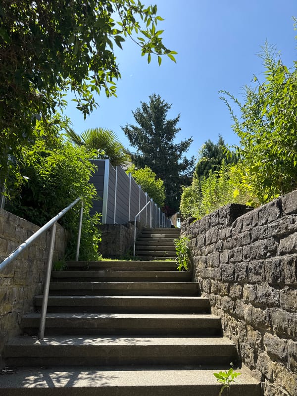 Stone stairs and a rusty weather vane in Bietigheim-Bissingen greenery