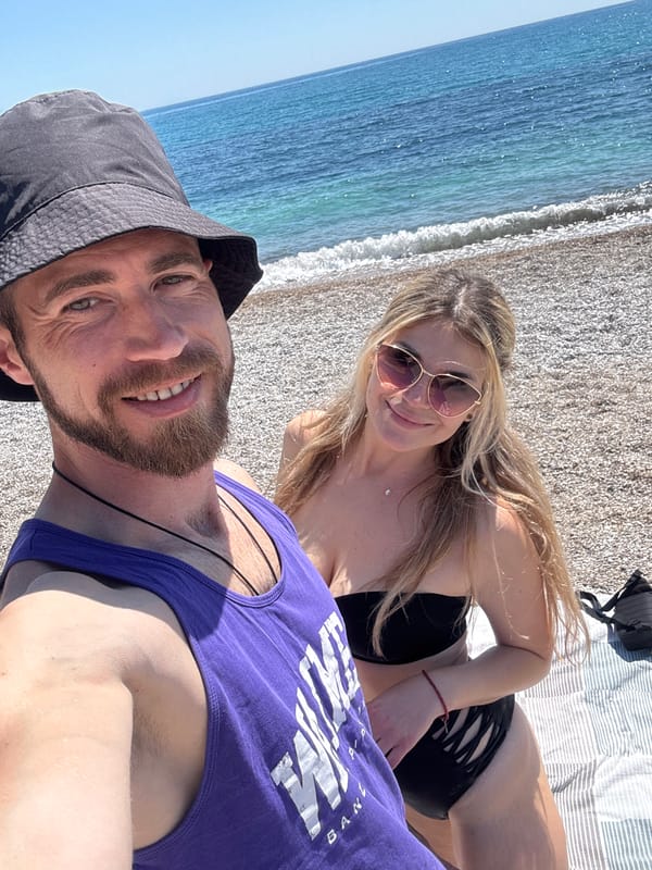 Couple enjoys sunny beach day in Prijevor, Montenegro