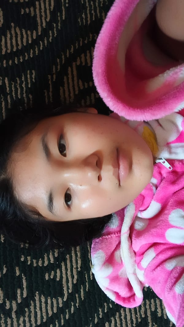 Close-up in Uchkun: pink polka-dot jacket, lying down