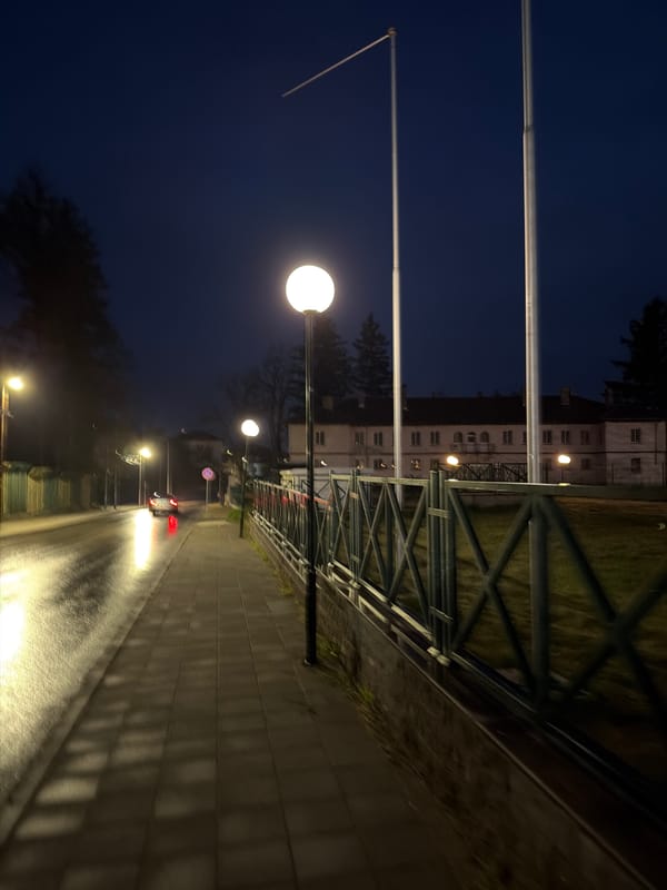 Nighttime walk documented through wet streets in Panagyurishte, Bulgaria