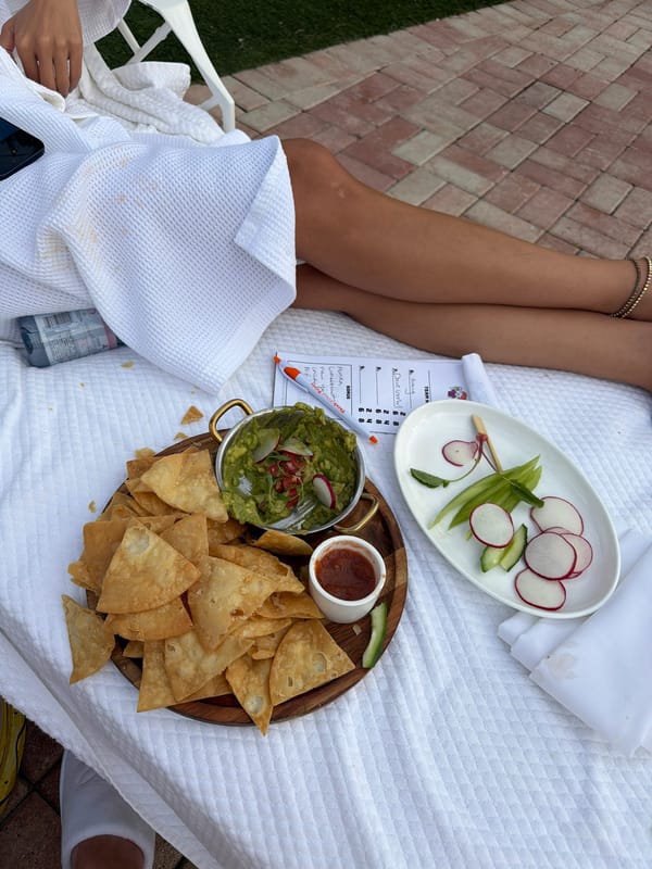 Person dines on vegetables outdoors in Palm Beach