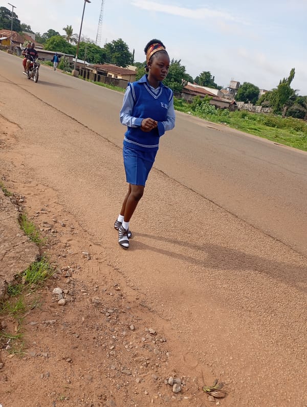 Morning street life in Shendam, Nigeria, with security presence