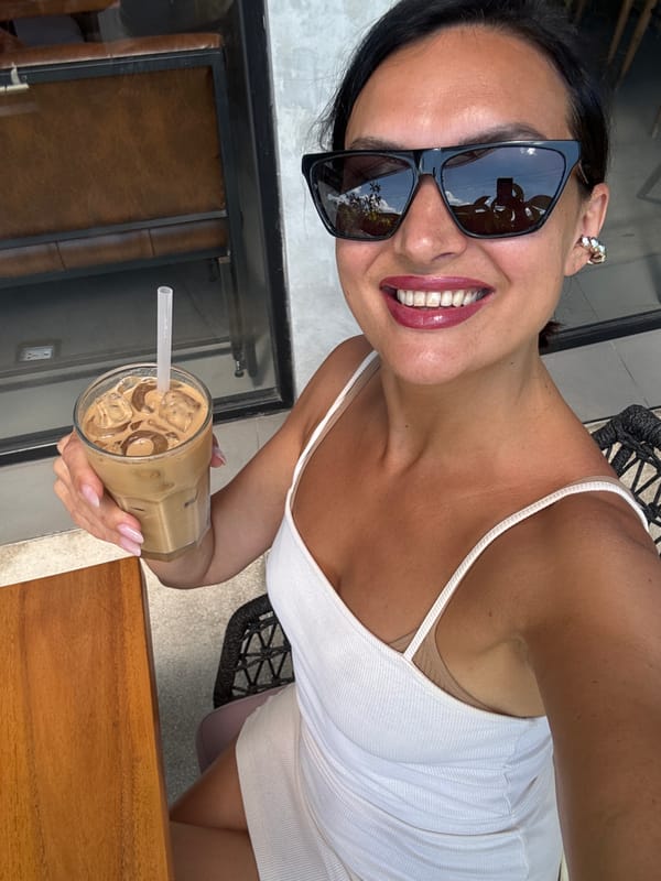 Woman photographed with iced coffee in North Kuta, Indonesia