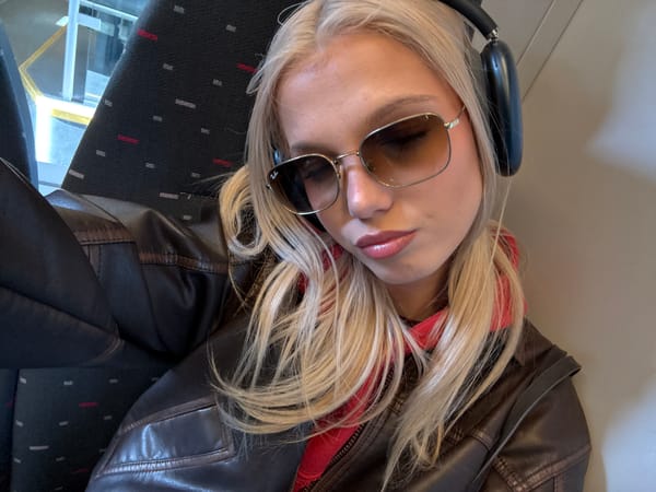 Train passenger rests during morning commute in Antwerp