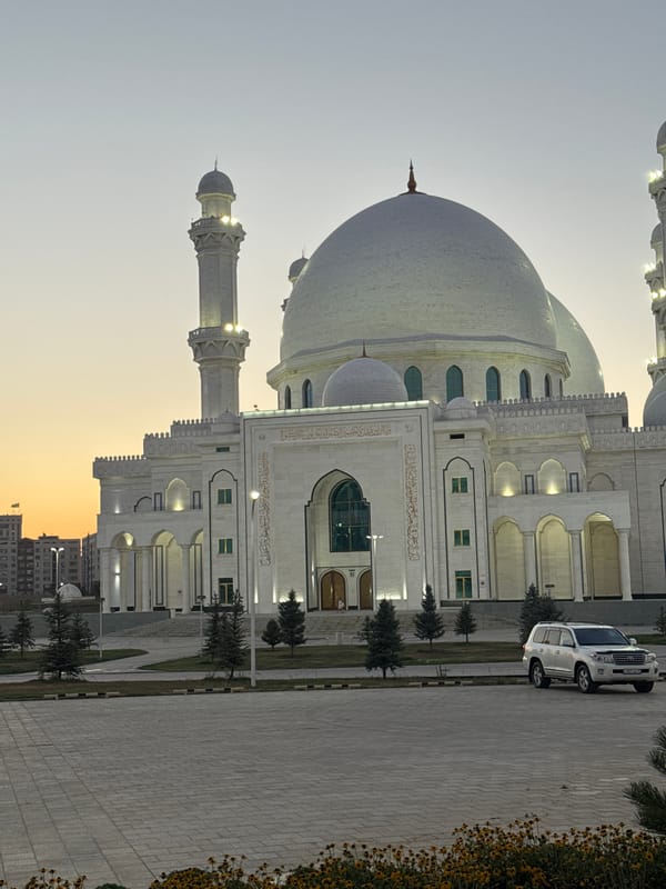 Hazret Sultan Mosque glowing under artificial lights in Shymkent