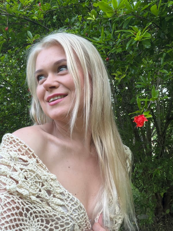 Outdoor portrait session among flowering greenery in Sochi