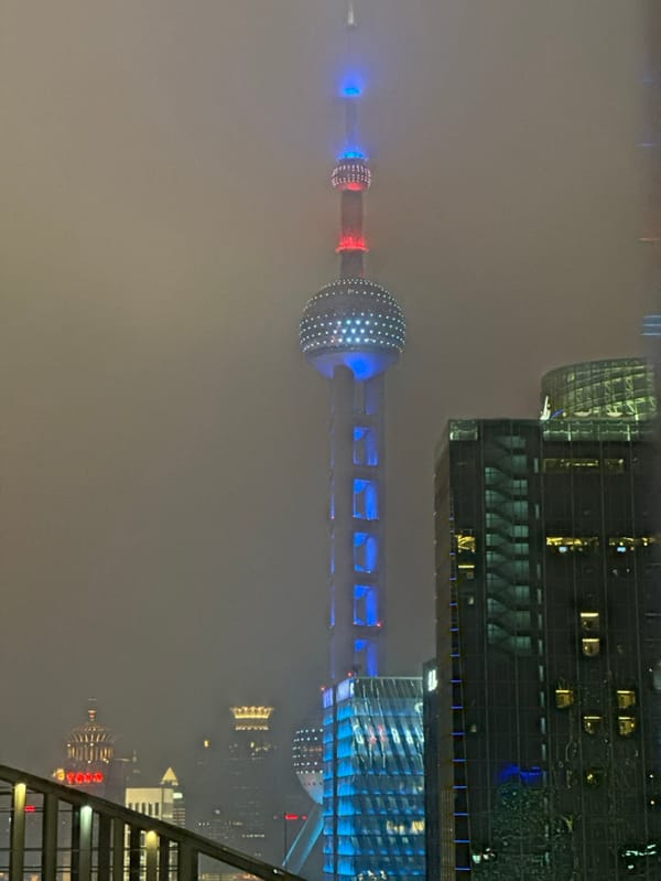 Oriental Pearl Tower emerges through dense fog in Shanghai