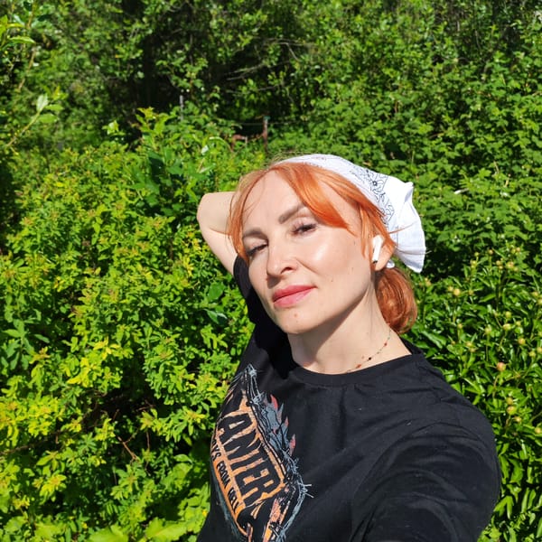 Woman poses outdoors amid nature photography session in Chaikovsky