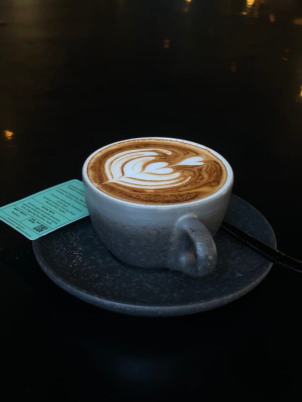 Latte art creation documented at Kuta cafe morning service