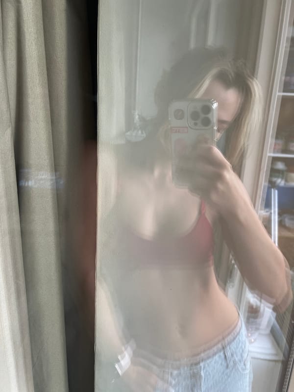 Person photographs themselves on tiled floor in Voronezh