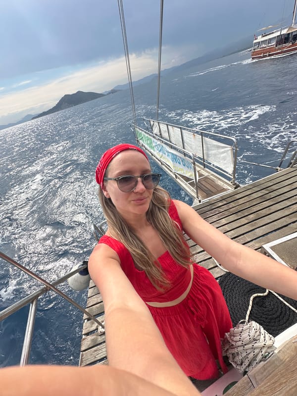 Tourist takes selfie on Mediterranean boat near Turkish coast