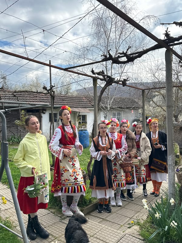 Women in traditional Bulgarian dress gather in Mrachenik