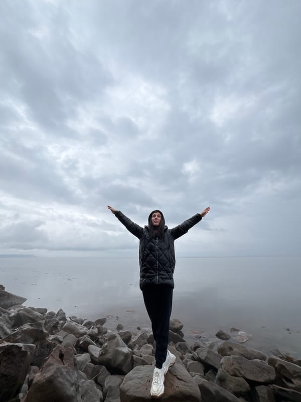 Two women explore rocky shores and forests near Kostovaty