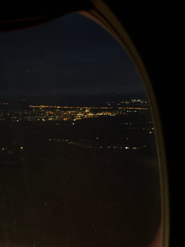 Nighttime city lights observed through window in Lobanovo, Russia