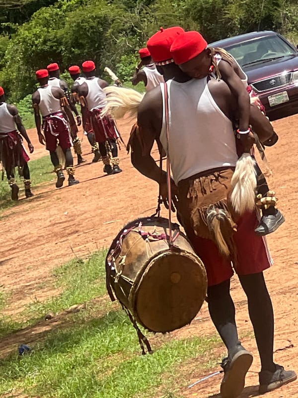 Traditional Igbo cultural procession held in Jos forest setting