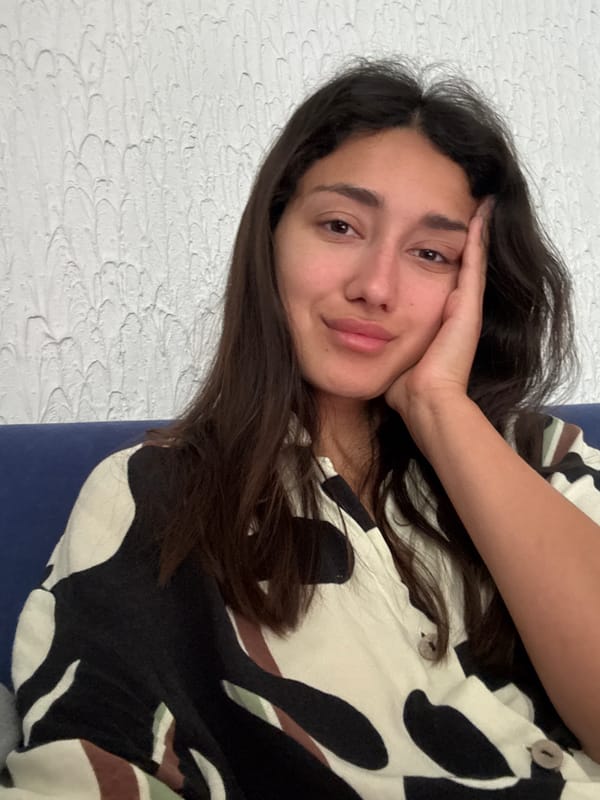 Woman takes indoor selfie portrait in Sutomore, Montenegro