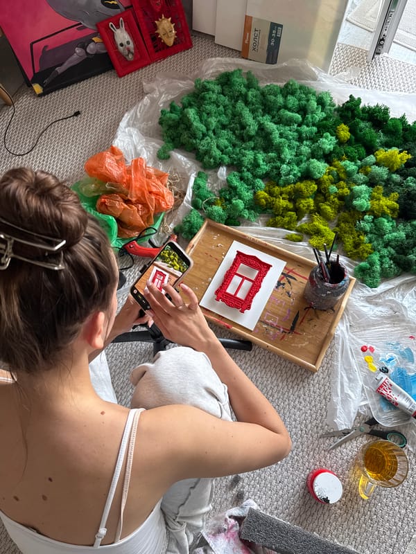 Artist documents craft project with smartphone in Krasnoyarsk