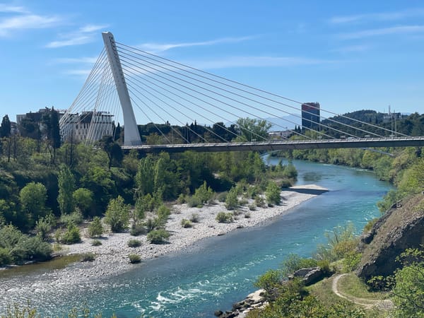 Cable-stayed bridge observed over turquoise river in Podgorica