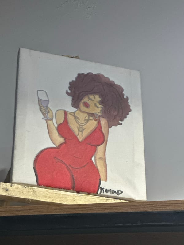 Painting of Black woman displayed on easel in Abuja
