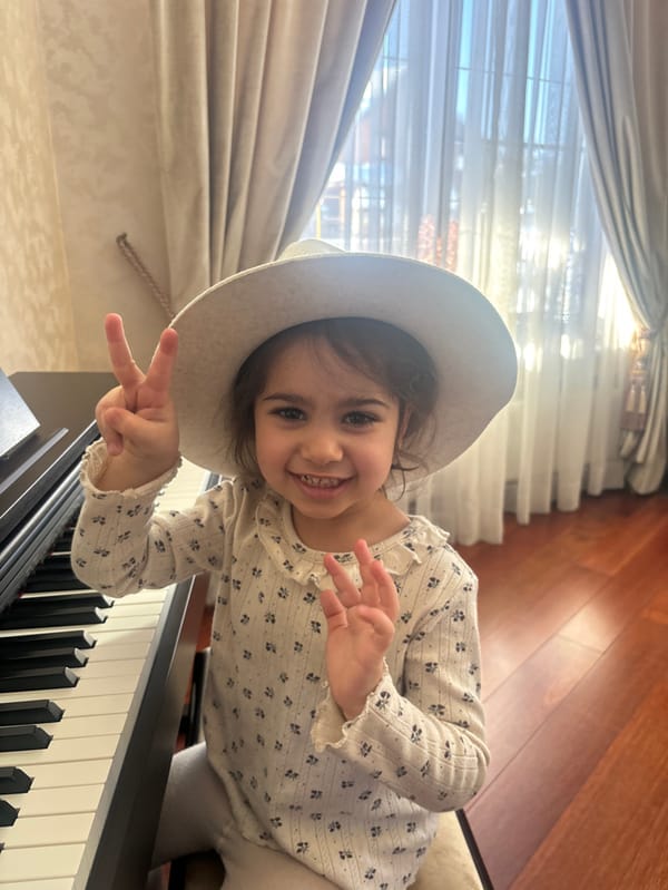 Young girl enjoys piano practice and snow play in Russian village
