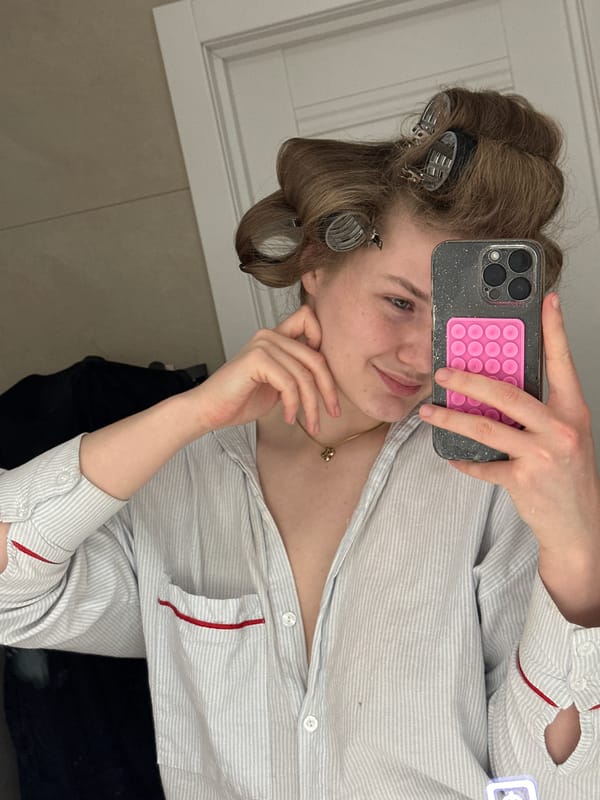 Woman takes selfie with hair rollers in Kazan