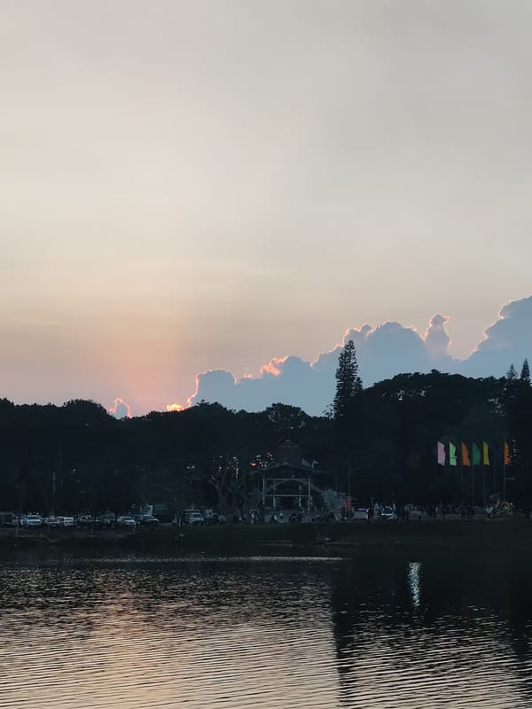 Evening lakeside gathering with street performers at Da Lat
