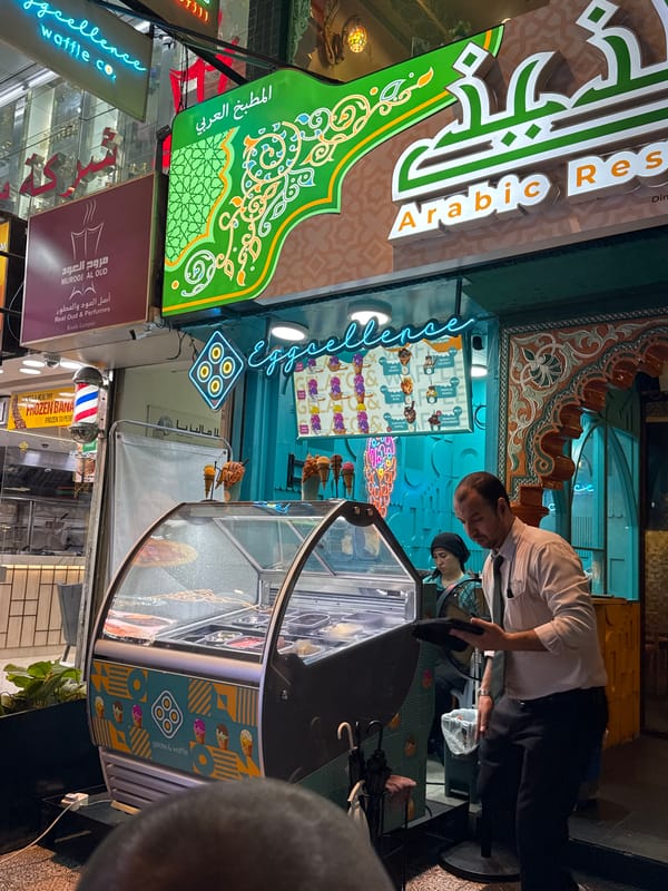 Evening shoppers browse luxury stores at Kuala Lumpur's Pavilion mall