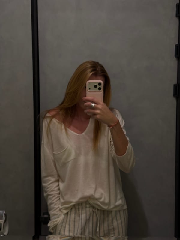 Woman takes mirror selfies at Bishkek restaurant