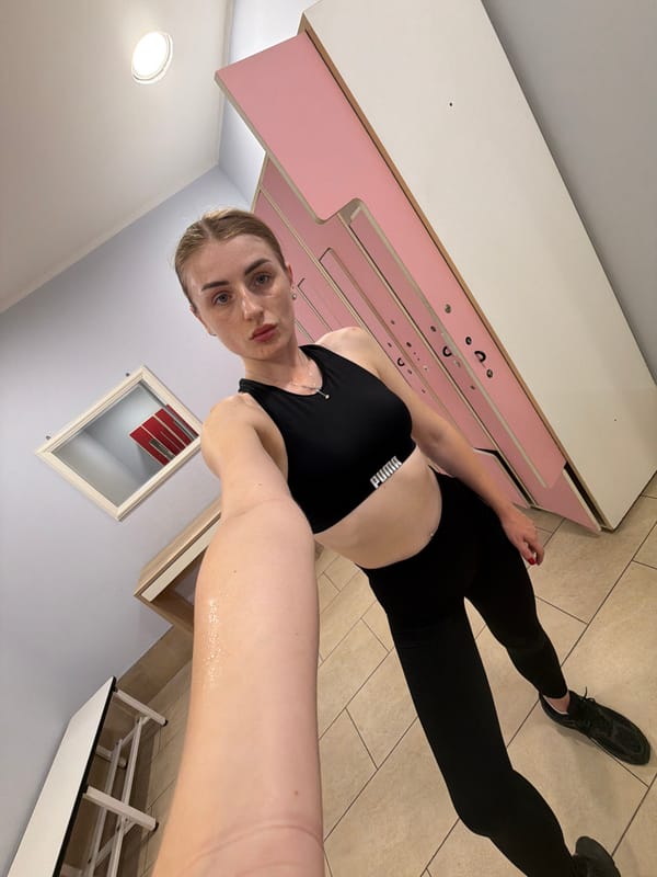 Locker room mirror selfies in Puma workout gear
